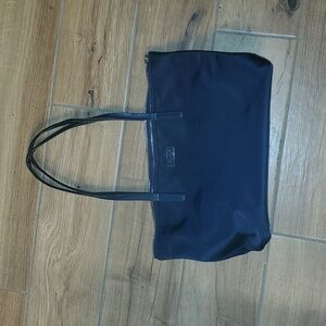 Navy blue Kate spade zippered tote. Straps have a lot of wear. See photos.